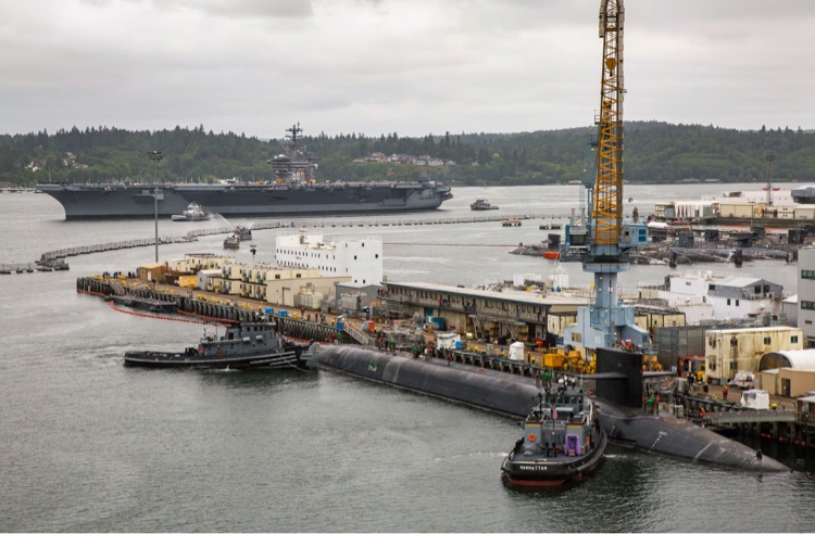 a submarine docked at a pier